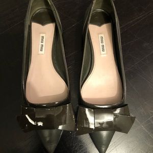 Miu Miu patent leather bow flats.